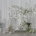 Decorative Ornament Set with Green Vase Twigs Glass Cover Books and Green Apples on Table