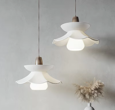Two White Petal Shaped Pendant Lights Illuminated Against Gray Wall With Dried Flowers 3d model