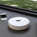 Smart Robot Vacuum Cleaner With Charging Dock On Wooden Floor Near Window
