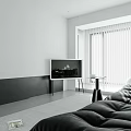 Minimalist Living Room With Black Sofa Large Windows And Light Rug