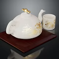 Elegant White Teapot And Mug With Gold Patterns On Wooden Tray