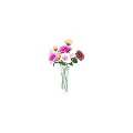Colorful Flowers Arranged in Transparent Glass Vase on White Table with Green Grass Background