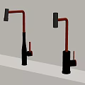 Two Modern Red And Silver Kitchen Faucets Mounted On White Countertop 3d model