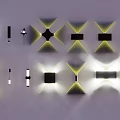 Modern Wall Sconces With Various Geometric Designs And Warm Yellow Lighting 3d model