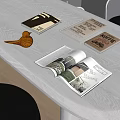 Open Coffee Themed Magazines And Books With Interior Design Pages And Wooden Bird Decor