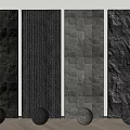 Different Textured Black Background Wall Panels With Decorative Spheres On Wooden Floor