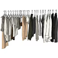 Assorted Clothes Hanging On Hangers With Various Styles And Colors Neatly Arranged