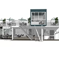 Two Story Blue And White Container Building With Balcony Plants And Outdoor Furniture