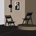 Two Modern Black Dining Chairs With Sleek Backrest Design In Interior