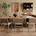 Wooden Dining Table Set With Wicker Back Chairs Black Vase Fruits And Potted Plant