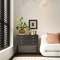 Dark Gray Dresser With Drawers Near White Sofa Orange Pillows Green Plant Framed Art And Black Shutters