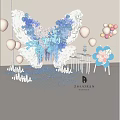 Butterfly Shaped Floral Installation With Blue And White Flowers Balloons Candles And Scattered Petals