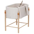 Light Colored Padded Baby Crib With Wooden Frame And Plush Rabbit Toys