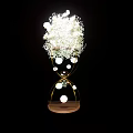 Banquet Hall Decor With Hourglass Shaped Golden Frame White Flowers And Illuminated Spheres