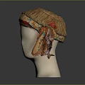 Orange Textured Headscarf With Green Leaf Pattern Red Trim Tied On Mannequin Head