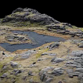 Natural Rocky Terrain With Small Water Pools And Green Grass Patches