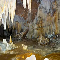 Underground Cave Scenery With Stalactites Stalagmites Natural Rock Formations Dripping Water And Rocky Walls