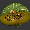 Fresh Sliced Pumpkin With Green Skin Showing Yellow Flesh And Seeds On Gray Surface