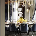 Luxurious Private Dining Room Interior With Round Table Blue Chairs Golden Chandelier And Yellow Flower Arrangement