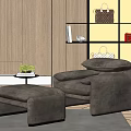 Comfortable Single Sofa with Matching Ottoman on Gray Rug and Wooden Wall Decor