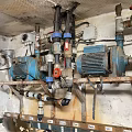 Industrial Mechanical Pipes System With Blue Pumps Valves And Motors In Workshop Facility