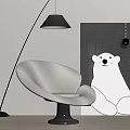 Modern White Lounge Chair With Floor Lamp And Polar Bear Painting Against Gray Wall
