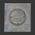 Decorative Manhole Cover On Stone Pavement With Metal Rim And Fasteners