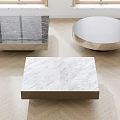 Modern Coffee Tables With Marble Tops And Metal Bases On Herringbone Wood Floor