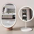 Oval and Round Mirrors with Pink and White Bases Reflecting Bathroom Cabinet and Towels