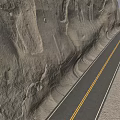 Winding Road Along Massive Rocky Cliff Featuring Double Yellow Lines And Gravel Ground