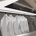 Neatly Hanging White And Gray Jackets On Clothing Rack With Metal Hangers