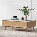Light and Dark Wood Coffee Table with Marble Top Books and Decorative Jar Vase
