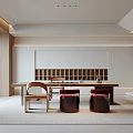 Modern Open Tea Room Interior With Wooden Long Table Red Cushions Bookshelf And Green Plants