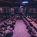 Hard Rock Bar Interior With Purple Lighting Music Neon Sign And Stage Seating Area