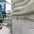 Modern Commercial Street With Curved Architecture Water Feature And Open Plaza