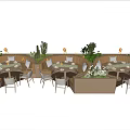Outdoor Dining Area With Comfortable Dining Chairs Tables Green Plants Cacti And Warm Lighting