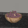 Fresh Purple Grapes in Wooden Bowl on Black Countertop with Light-Colored Wall