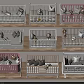 Stylish Baby Cribs In White And Pink With Pillows And Stuffed Toys