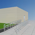 Outdoor Metal Railings Along Building Ramp with Green Grass and Gray Tiles
