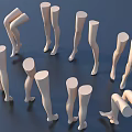 White Mannequin Leg Models In Various Poses Standing And Bending On Dark Blue Background