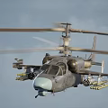 Military Helicopter With Rotors Mounted Weapons Gray Fuselage And Light Blue Nose On Ground