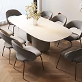 Oval Beige Dining Table Set With Gray Metal Leg Chairs And Wooden Floor