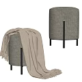 Gray Ottoman With Metal Legs And Beige Knitted Blanket On Top