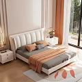 White Upholstered Double Bed With Gray Bedspread Orange Cushion Patterned Pillow And Nightstands