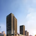 Modern Twin High Rise Office Buildings With Glass Facade And Blue Sky