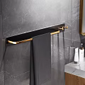 Bathroom Interior with Marble Wall Black Gold Towel Rack Gray Towel and Toiletries