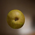 Fresh Green Pear With Bite Mark And Exposed Juicy Flesh On Blurred Background