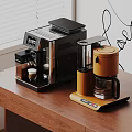 Modern Kitchen Appliances With Black Espresso Maker And Orange Coffee Machine On Wooden Table