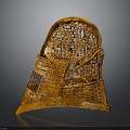 Ancient Weapon Helmet Featuring Ornate Orange Carved Details And Intricate Patterns