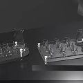 Stylish Glass Wine Bottles and Stemmed Glasses Arranged on Modern Tray for Elegant